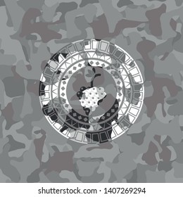 bunch of grapes icon inside grey camouflage texture