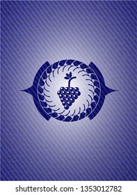 bunch of grapes icon inside jean or denim emblem or badge background