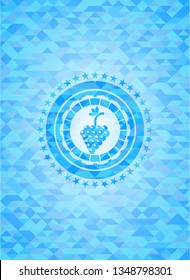 bunch of grapes icon inside light blue emblem. Mosaic background