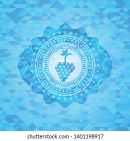 bunch of grapes icon inside light blue emblem with mosaic background