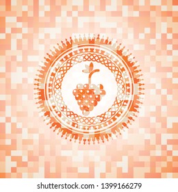 bunch of grapes icon inside orange mosaic emblem