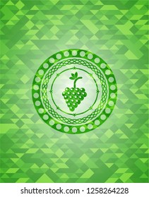 bunch of grapes icon inside realistic green emblem. Mosaic background