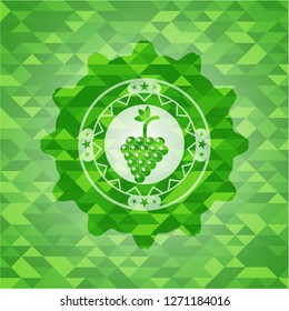 bunch of grapes icon inside realistic green mosaic emblem