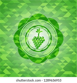 bunch of grapes icon inside realistic green mosaic emblem