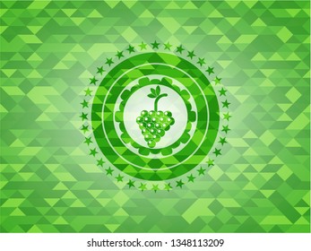 bunch of grapes icon inside realistic green mosaic emblem