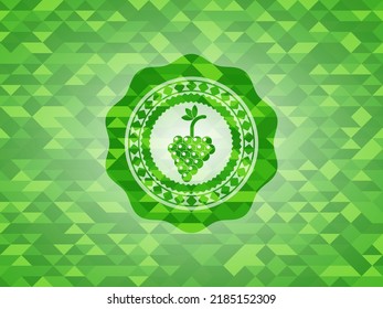 bunch of grapes icon inside realistic green emblem. Mosaic background. 
