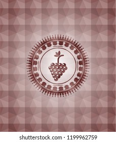 bunch of grapes icon inside red seamless geometric badge.