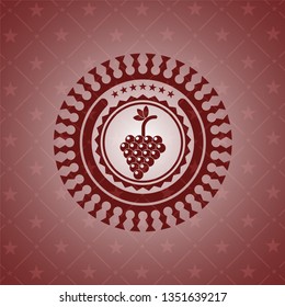 bunch of grapes icon inside red emblem