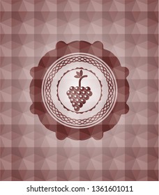 bunch of grapes icon inside red seamless emblem with geometric background.