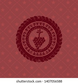bunch of grapes icon inside red icon or emblem