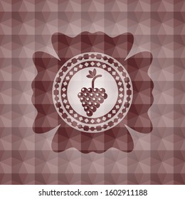 bunch of grapes icon inside red seamless emblem with geometric pattern background.