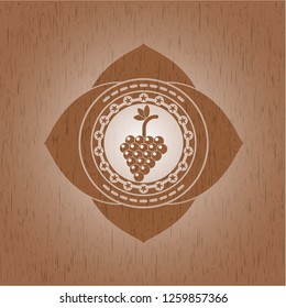 bunch of grapes icon inside retro wood emblem