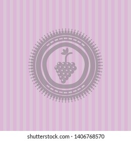 bunch of grapes icon inside retro pink emblem