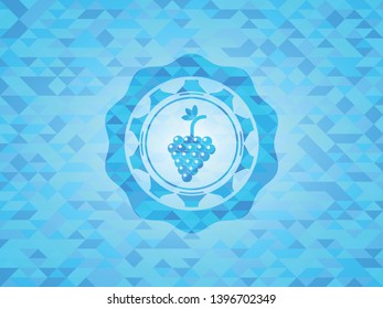 bunch of grapes icon inside sky blue emblem. Mosaic background