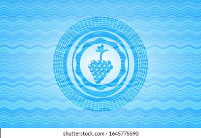 bunch of grapes icon inside sky blue water wave style badge.