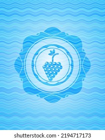 bunch of grapes icon inside sky blue water wave badge background. 
