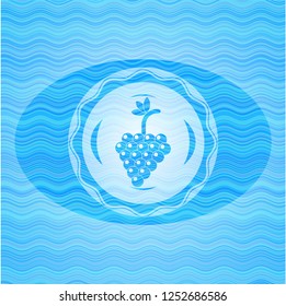 bunch of grapes icon inside water concept style badge.