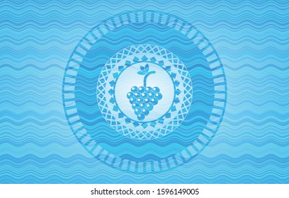 bunch of grapes icon inside water concept emblem.
