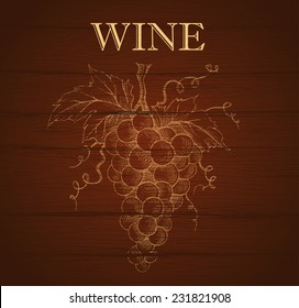 Bunch of grapes on wood background. Wine label 