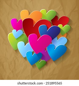 bunch of hearts colorful in the middle crumpled paper brown