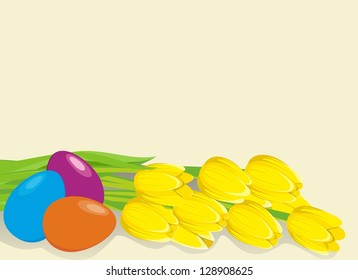 A bunch of lovely bright yellow spring tulips with easters eggs