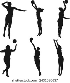 A Bunch of people playing beach volleyball silhouette