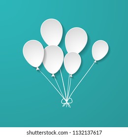 a bunch of white paper balloons