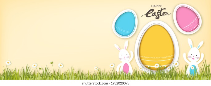 Bunnies with empty colorful eggs for adding your texts or pictures in beige color banner background with happy Easter text
