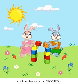 bunnies sitting in a meadow and playing with cubes
