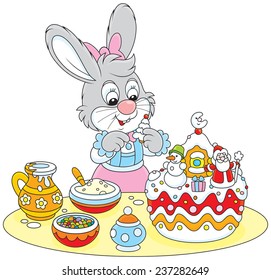 Bunny decorating a Christmas cake