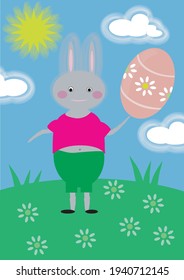 Bunny with an Easter egg on a green glade