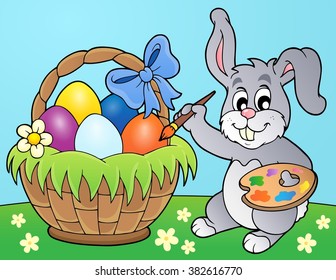 Bunny painting eggs in basket - eps10 vector illustration.