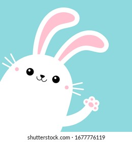 Bunny rabbit in the corner waving paw print hands. Yellow scarf. Cute kawaii cartoon funny smiling baby character. White farm animal. Happy Easter. Blue background. Isolated. Flat design. Vector