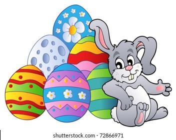 Bunny resting beside Easter eggs - vector illustration.