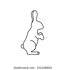 Bunny sitting warily with stand ears and tucked paws in outline style icon
