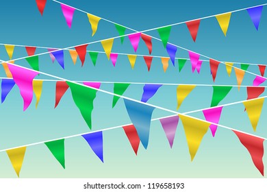 Bunting Flags Blowing in the Wind Against A Blue Sky