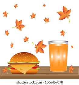 burger and a glass of juice on the background of falling leaves