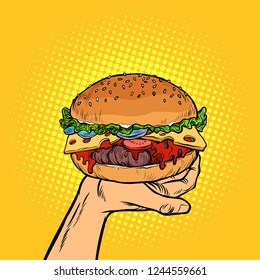Burger on hand. fast food. Pop art retro vector illustration vintage kitsch