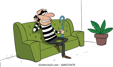 Burglar breaking into an apartment sitting on a couch talking on the phone
