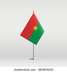 Burkina Faso flag state symbol isolated on background national banner. Greeting card National Independence Day of the Republic of Burkina Faso. Illustration banner with realistic state flag.