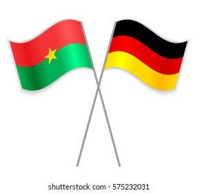 Burkinabe and German crossed flags. Burkina Faso combined with Germany isolated on white. Language learning, international business or travel concept.