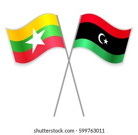 Burmese and Libyan crossed flags. Myanmar combined with Libya isolated on white. Language learning, international business or travel concept.