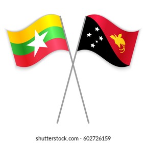 Burmese and Papuan crossed flags. Myanmar combined with Papua New Guinea isolated on white. Language learning, international business or travel concept.
