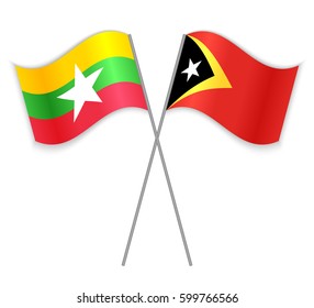 Burmese and Timorese crossed flags. Myanmar combined with East Timor isolated on white. Language learning, international business or travel concept.