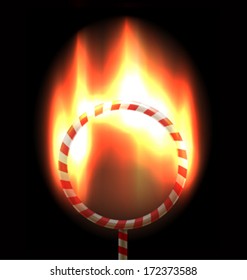 Burning in bright flames circus hoop over dark background as a symbol of business challenge