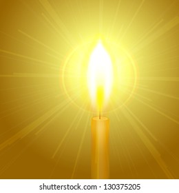 Burning candle with a halo around the flame
