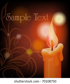 Burning candle on dark background