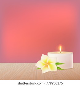A burning candle and a white vector flower on a wooden surface.  Eastern medicine.