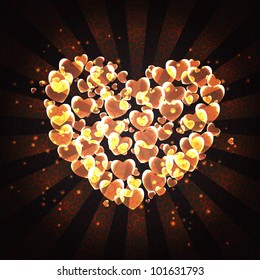 burning heart with sparkles on a dark background