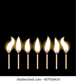 Burning matches on black background